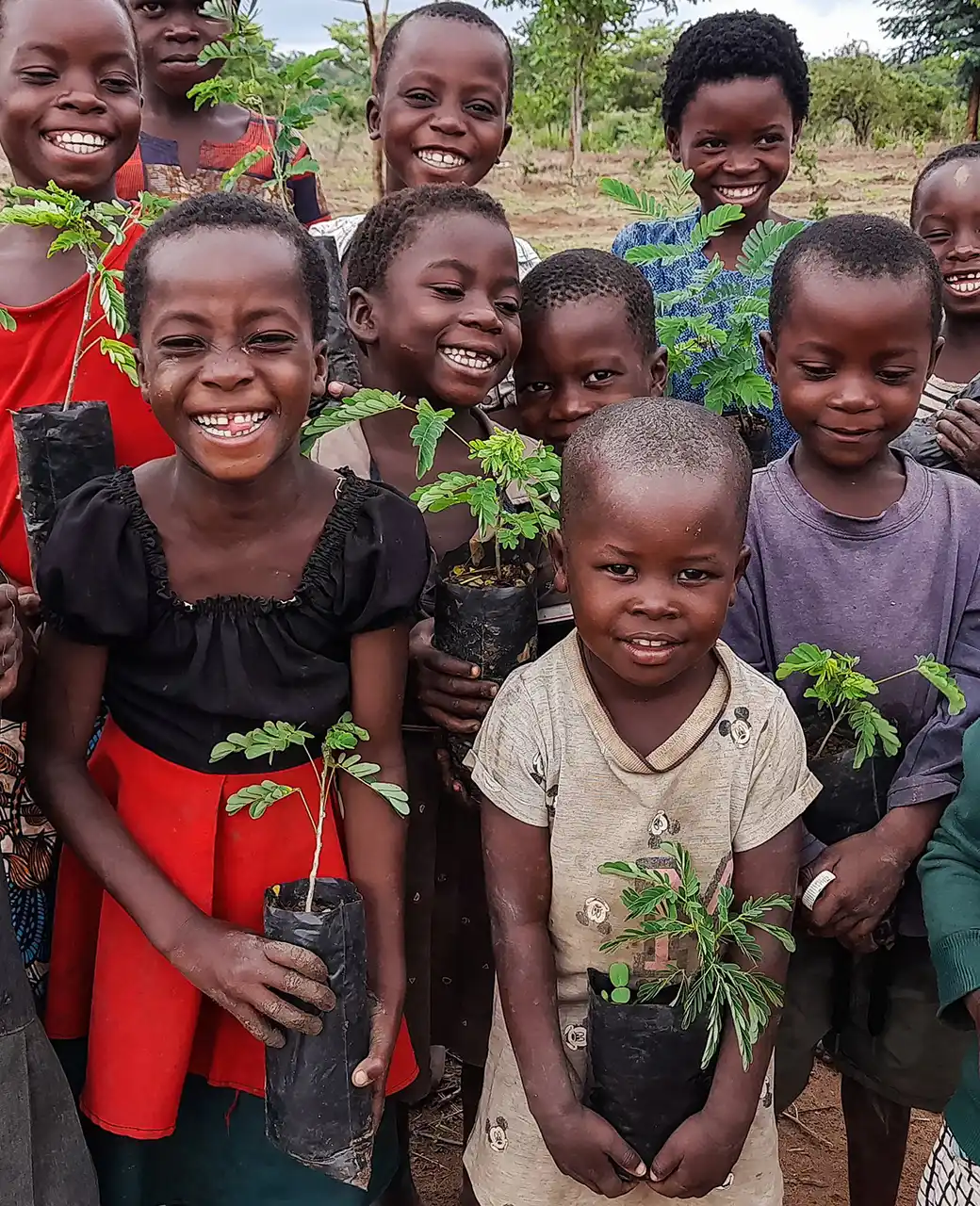 Compact-Resource-Foundation–How-to-Donate-children-holding-saplings