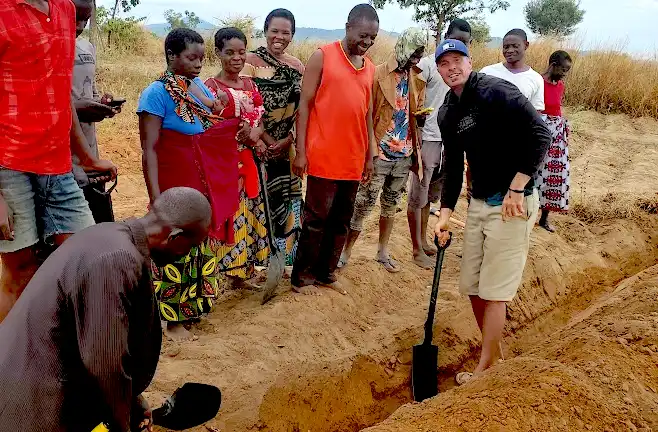 CompactRF–Board-Members-Visit-2025–Zeb-teaches-about-berms-and-swales